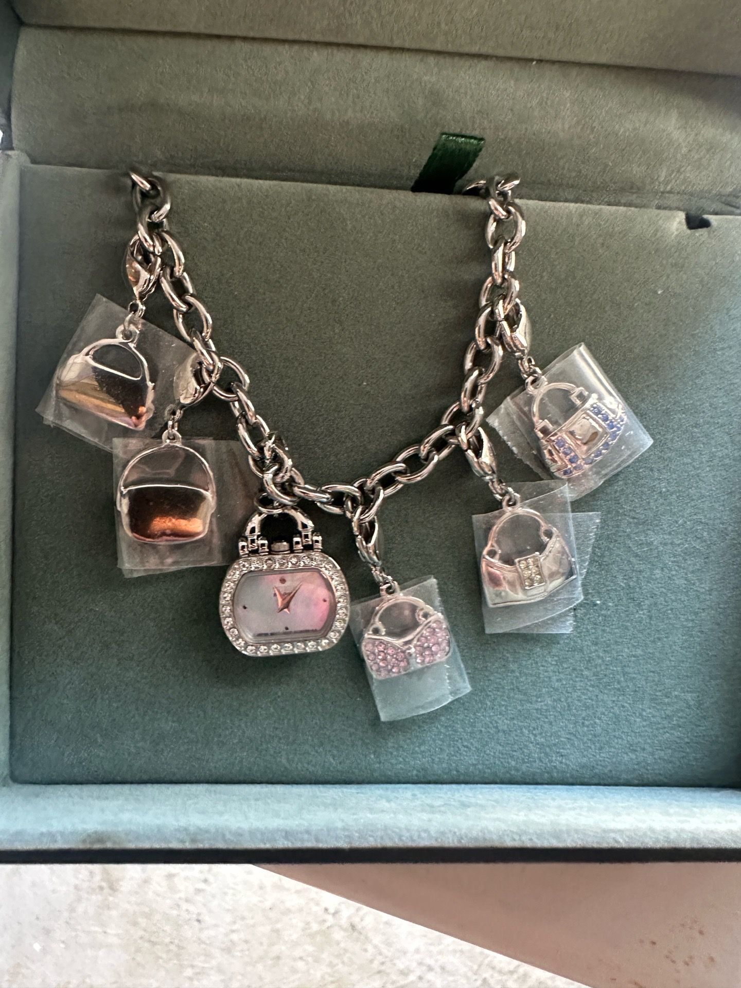 Citizen women’s charm bracelet watch