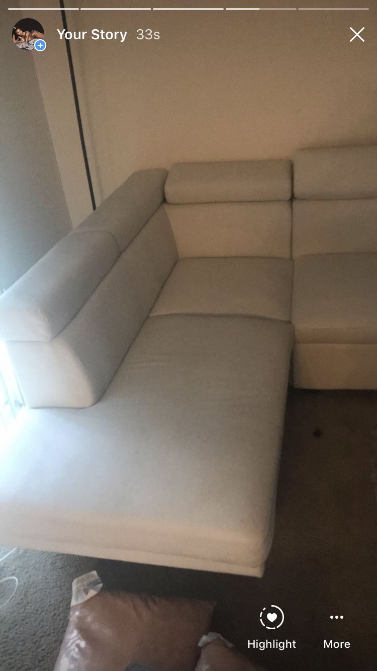 White leather sectional sofa with pullout bottom