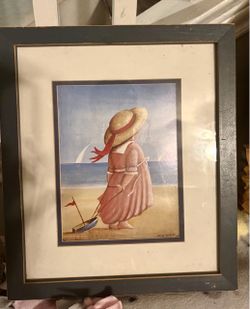 Adorable little Victorian girl gazing at the ocean.