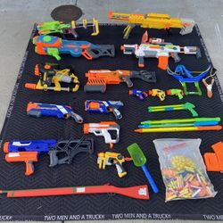 Various NERF toys with darts