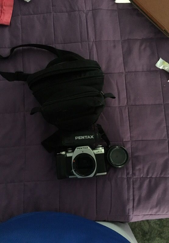 Pentax ZX M camera with lens and camera bag