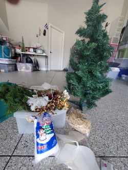 Small Small christmas tree with lights plus tree stand and various holiday craft