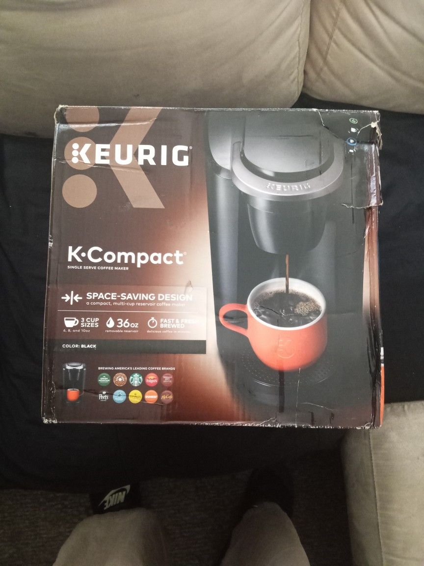 A NEW COFFEE MAKER IN THE BOX.