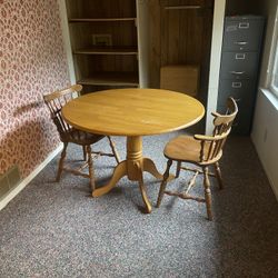 41” Wood Pedestal Leg Round Table With a 9” Drop Leaf on Each Side And The Two Chairs As Pictured.