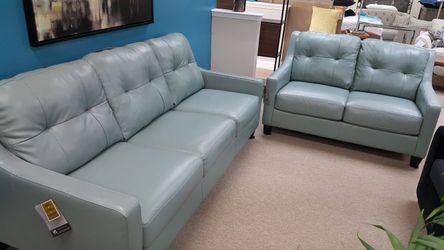 Leather sofa and love seat. Floor model