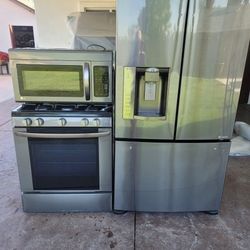 Set Of LG Appliances. Microwave Refrigerator and oven.