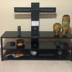 Multi-purpose Black Glass TV Stand With Shelving And Can Hold Up To 75 Inch TVunit. 