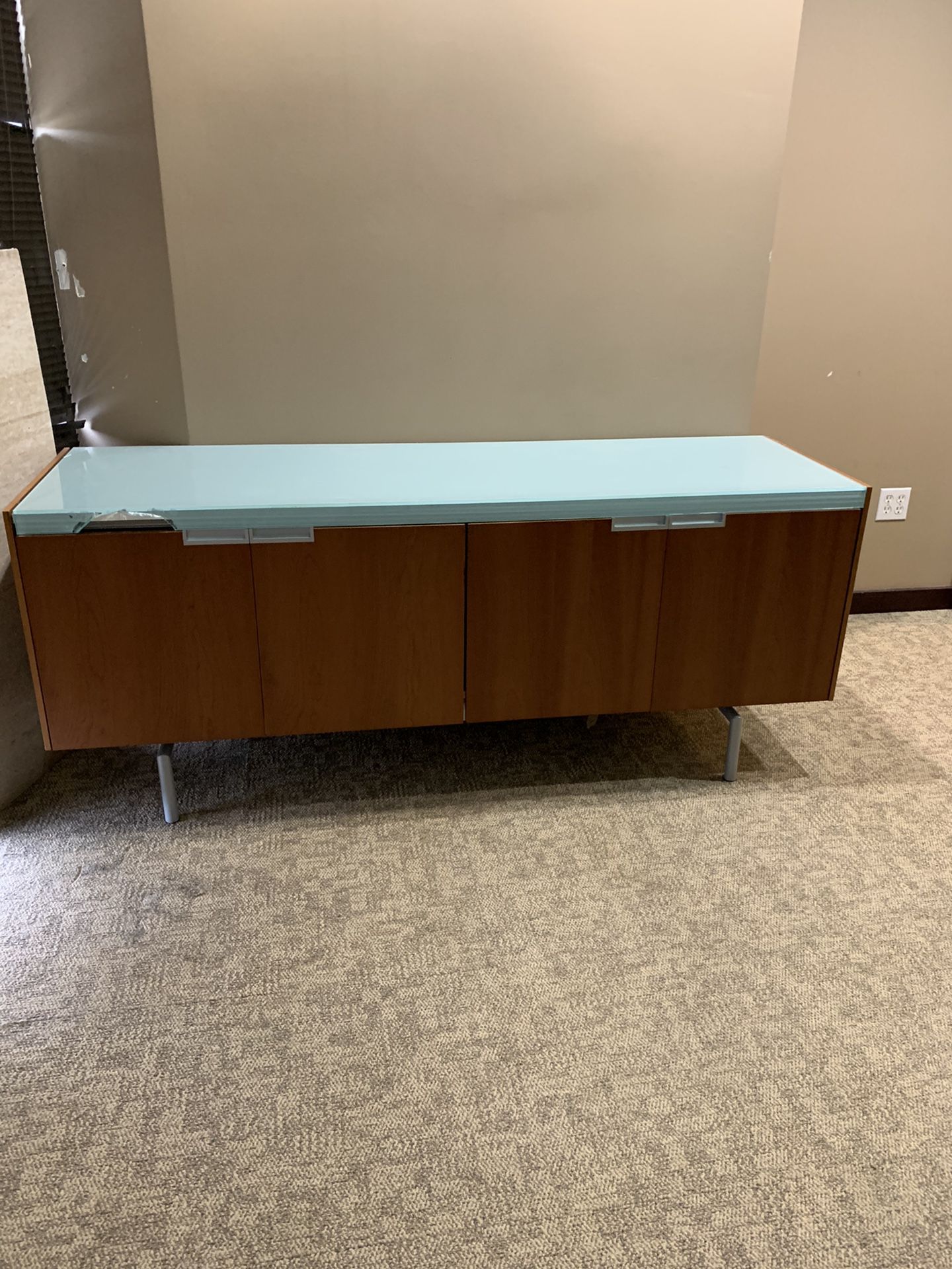 Glass topped credenza or sideboard