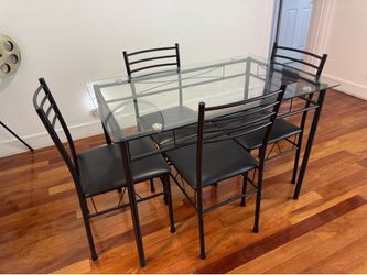 MOVING! MUST GO! Glass dining room table with 4 chairs