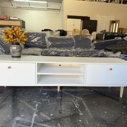 64” wide, 15” deep, and 17” tall TV stand embodies the essence of modern simplicity. Its clean lines and pure white finish make it a stylish centerPcs