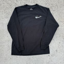Black Nike tee long sleeve with multi-coloured graphics size small