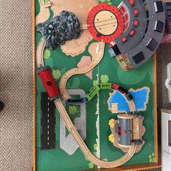 Complete train set with additional building tracks, train case, train table and trains