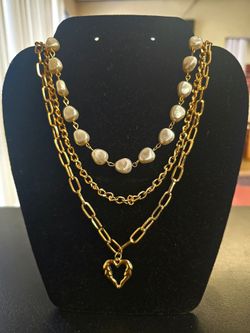 Costume jewelry  - gold necklace. 1 necklace but looks like 3.