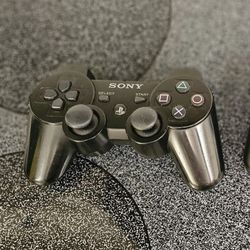 2 Play Station Controllers