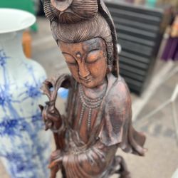 Iron Wood Statue   of Guanyin, a significant figure in Chinese culture