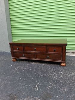Dark wood coffee table with 5 drawers