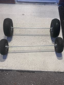 4 total wheels . Read Two 13 x 5-6in. Pneumatic Wheels with Turf Tread, 5/8 in, in excellent condition. 400lbs max. NOT FOR HIGHWAY USE. Ideal for han