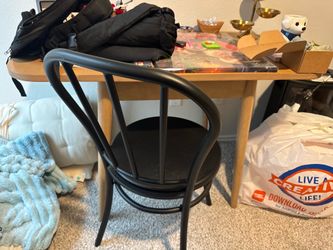 Small table with two black metal chairs
