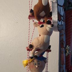 Hanging Rudolph Red Nose Reindeer Hermey Clarice plush toys on wooden swing with tags 