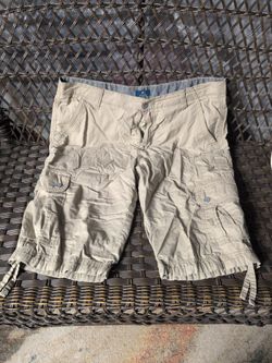 These are George khaki cargo shorts featuring multiple utility pockets and adjustable drawstring hems.  (  Clothing #001 )