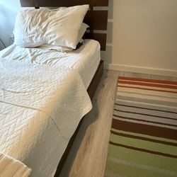 Modern chocolate-colored twin bed for sale in great condition.