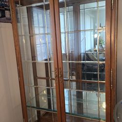 Philip Reinisch Co. Illuminated Curio Oak Cabinet with Beveled glass doors