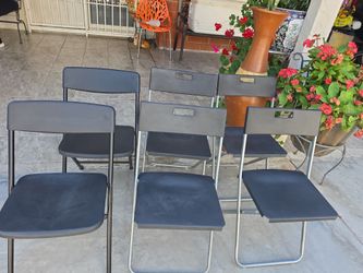 Six folding light weights chairs