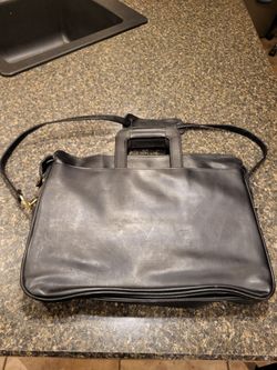 Palzone 11x16" briefcase with shoulder strap and tuck-away retractable handles