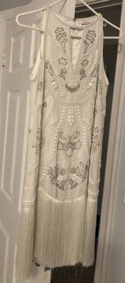 1920’s style dress. Bought as a beach wedding dress.