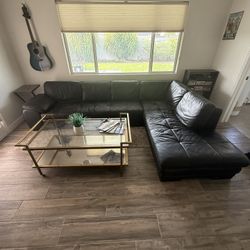 Black Leather L Shaped Couch And Glass Mirror Table 