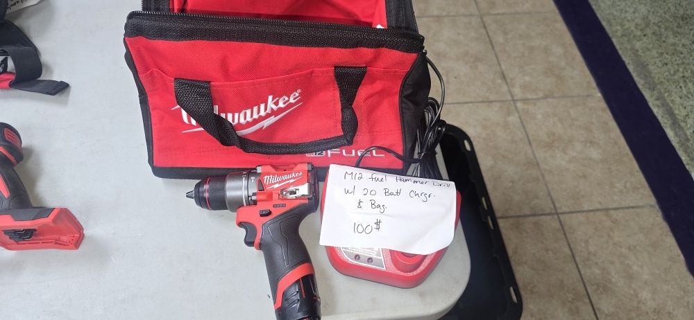 NEW MILWAUKEE FUEL M12 HAMMER DRILL WITH BATTERY AND CHARGER IN BAG FOR 100$
