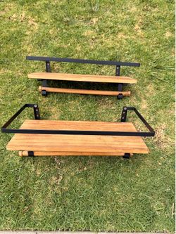 2 small wooden shelves with 3 hooks to hang items from the bar.