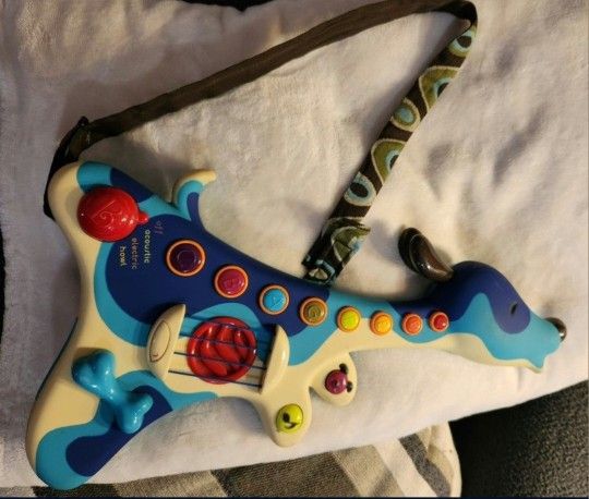 B. Toys Woofer Interactive Dog Guitar