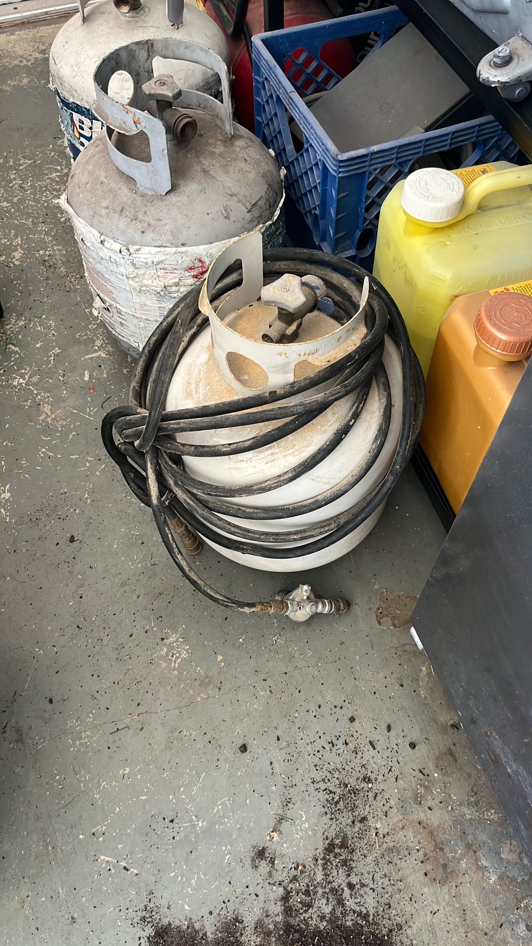 Three gas tanks with pressurized hose and valve
