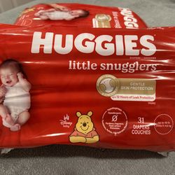 NEW!!! BOXES OF NB HUGGIES DIAPERS 