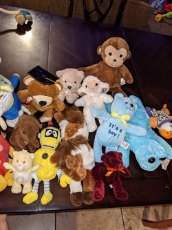 Assortment Of Plushies And Stuffed Animals 