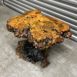Hall’s resin treated Burl wood coffee table located near the Miami Design District that measures 27” l x 22” w x 17.25” h 