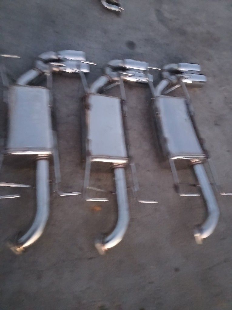 STAINLESS STEEL EXHAUST!! NOT SURE WHAT THEY GIT!! 125$ EACH