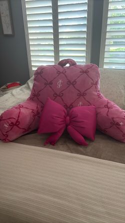 Juicy back pillow and small bow pillow for decor.