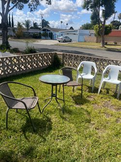 3 piece Outdoor Bistro Set with Glass Top Table and 3 white plastic chairs