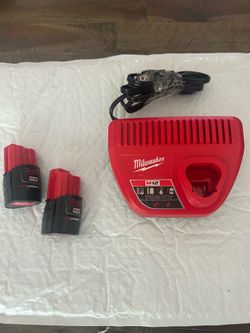Milwaukee M12 charger with two lithium M12 2.0 oh batteries new