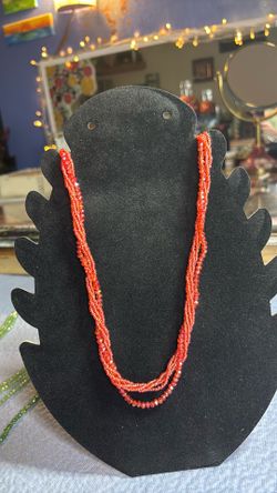 Red multi strand necklace