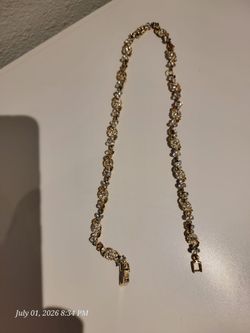 Gold-toned necklace/bracelet with rhinestones.