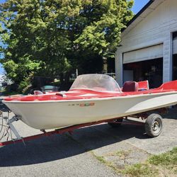 15 Ft Boat. 1959 Holiday With Original Trailer. Red And White With Tail Fins