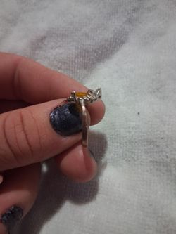 Sterling silver band with an oval shaped yellow sapphire