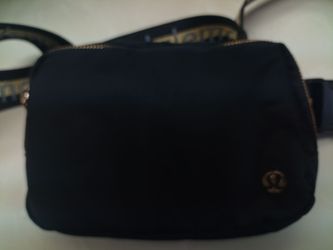 Black and gold Lululemon cross bag