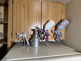 Paint sprayer guns