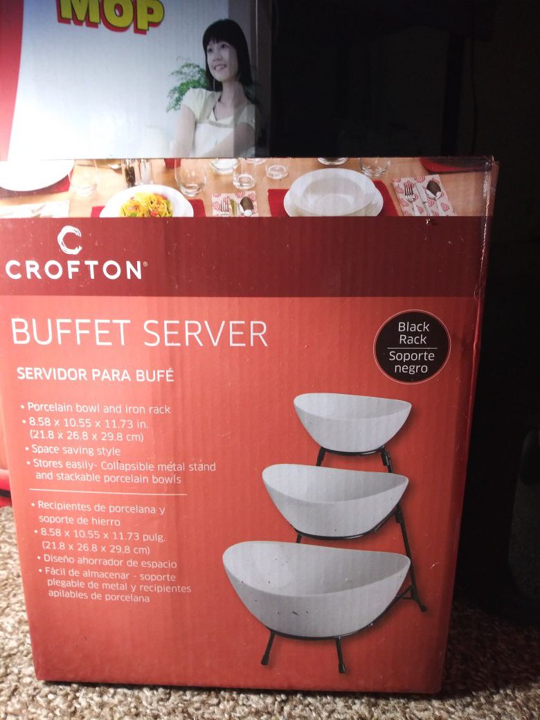 Buffet server . porcelain bowl and iron rack