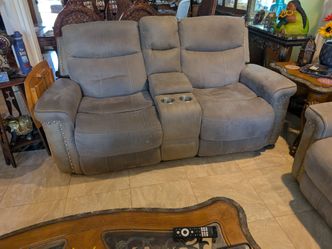 Set of loveseat sofa seat they all have a recliner in very very good condition. And another chair a taupe color