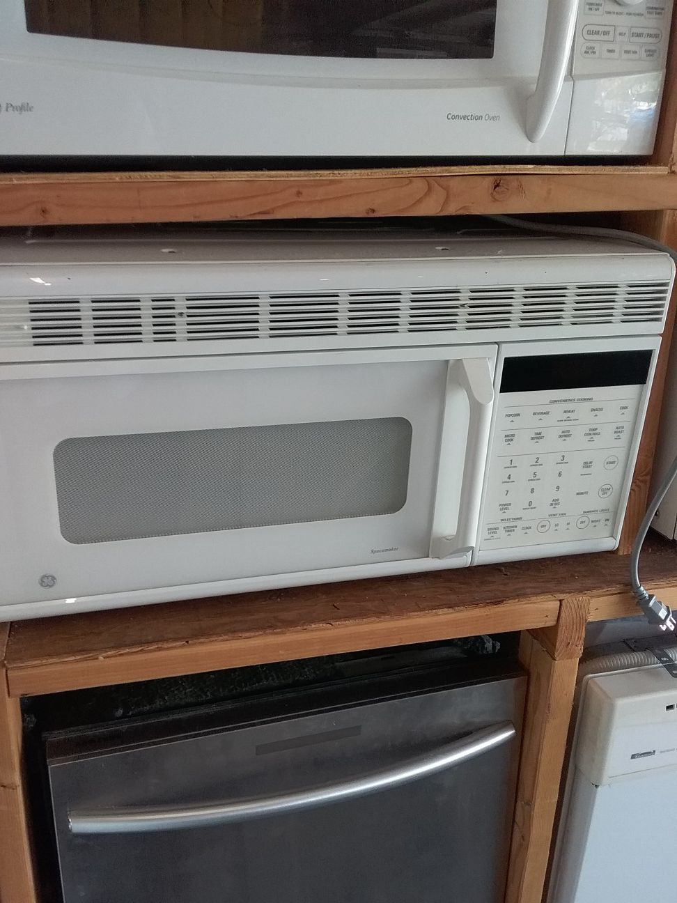 White ge over the range microwave bracket and screws included in good working condition